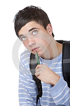 Young contemplative male student sitting on floor