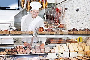 Young cook at butcher store