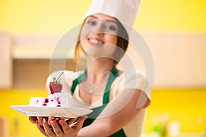 The young cook cooking cakes in the kitchen