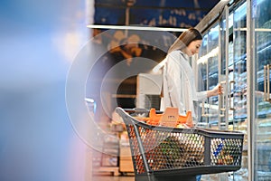 Young cool customer woman wear casual clothes shopping at supermaket store grocery shop