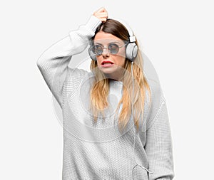 Young cool student woman with headphones