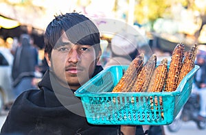 A young corn seller from Afghanistan.