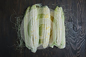 Young corn on the wooden table