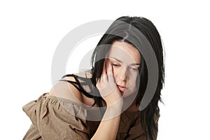 Young corpulent woman with depression