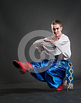Young cossack dancing photo