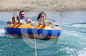 Young couiple on water attractions during summer vacations