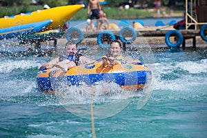 Young couiple on water attractions during summer vacations