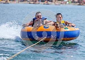 Young couiple on water attractions during summer vacations