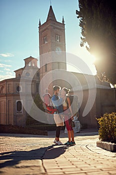 Young couple is abut to kiss at sunset in italy, toskana