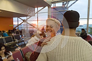 Young Couple In Airport Lounge Waiting Departure Happy Smile Man And Woman