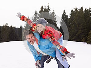 Young Couple In Alpine Snow Scene