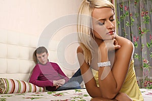Young couple argue in bedroom