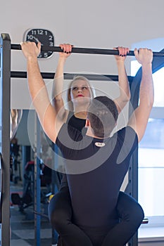 Young Couple Athlete Doing Pull Ups Training Back Together