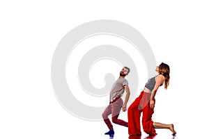 Young couple ballet dancing on white background