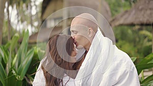 Young couple at the beach. Happy cheerful couple having fun together. Concept romantic vacation, honeymoon.