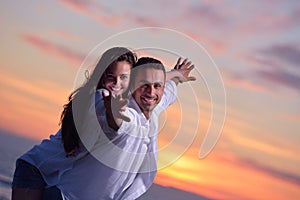 Young couple on beach have fun