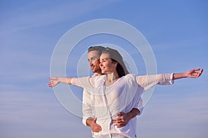 Young couple on beach have fun