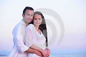 Young couple on beach have fun