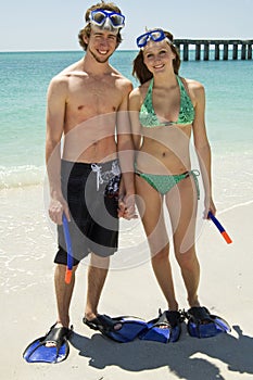 Young couple on beach snorkel