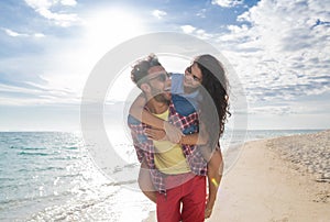 Young Couple On Beach Summer Vacation, Happy Smiling Man Carry Woman Back Seaside