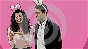 Young couple are beautiful on pink background. During this time, they are dressed in rabble ears. Looking at each other