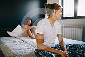 Young couple in bed having problems and crisis. Divorce and separation