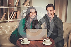 Young couple behind table discussing