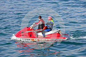 Young couple on board a large jetbike