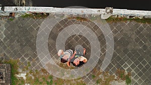 Young couple on the bridge. Serangan, tropical island of Bali, Indonesia.