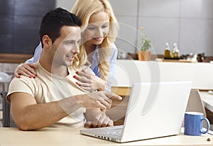 Young couple browsing internet at home