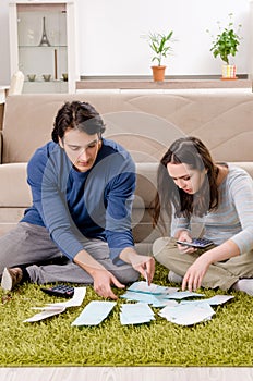 The young couple in budget planning concept