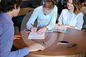 Young couple buy apartment with realtor contract