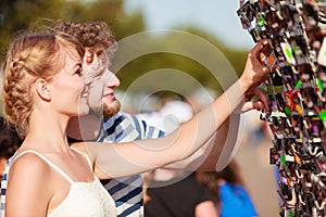 Young couple buying new sunglasses outdoor