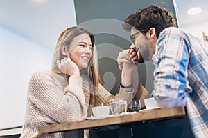 Couple in cafe enjoying the time spending with each other