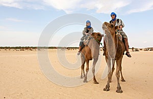 Young couple on camels