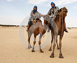 Young couple on camels