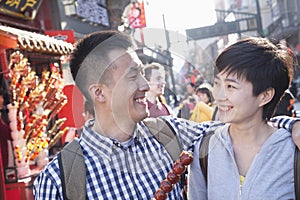 Young couple with candied haw.