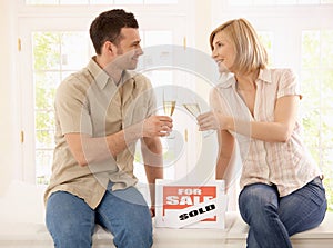 Young couple celebrating new home