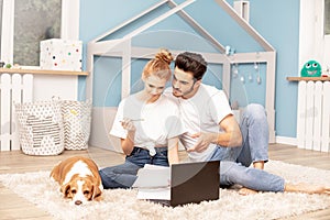 Young couple in children`s room