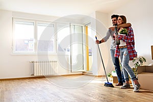 Young Couple Choosing Colors for Painting their Home