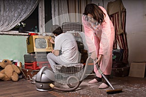 Young Couple Cleaning an Abandoned Room