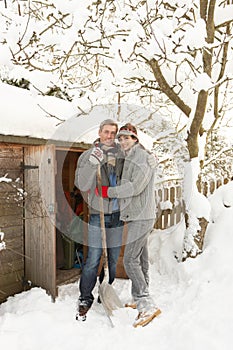 Young Couple Clearing Snow photo