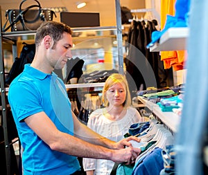 Young couple in the clothes shop