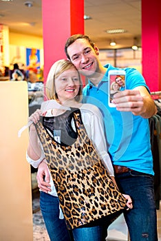 Young couple in the clothes shop