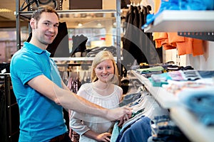 Young couple in the clothes shop