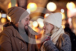 A young couple is cold in the walk of the city. Relationship, together, Xmas