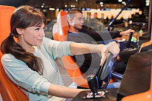 Young couple computer playing car racing video game