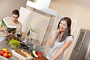 Young couple cooking in modern kitchen