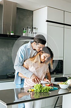 Young couple cooking a vegetarian breakfast