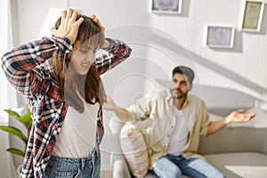 Young couple on counseling session with psychotherapist